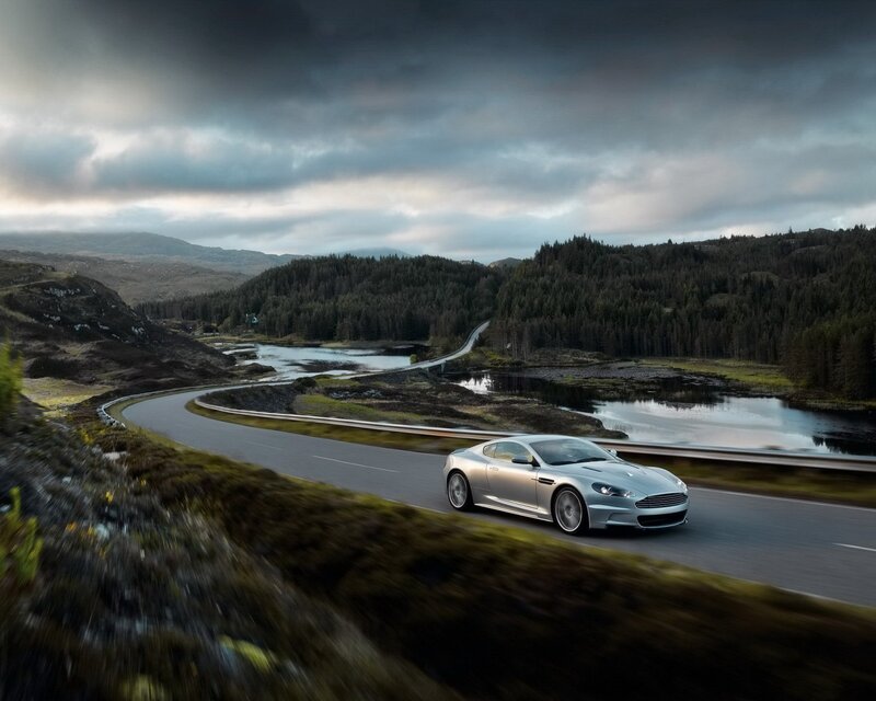 Silver sports car on a winding road