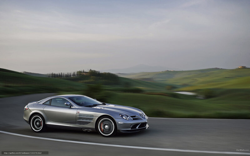 Silver sports car on a winding road