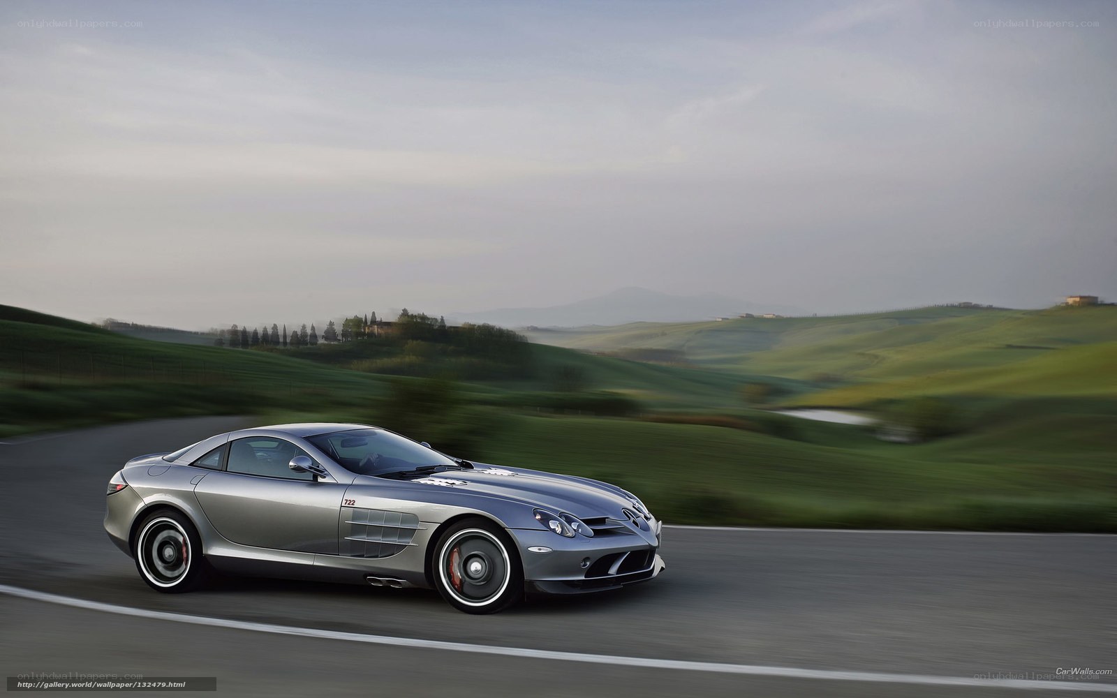 Silver sports car on a winding road