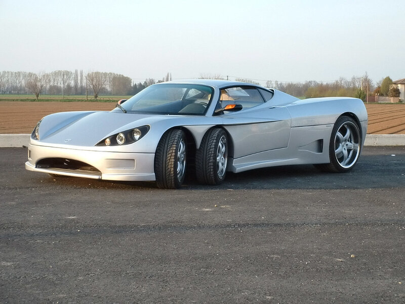 silver sports car on asphalt