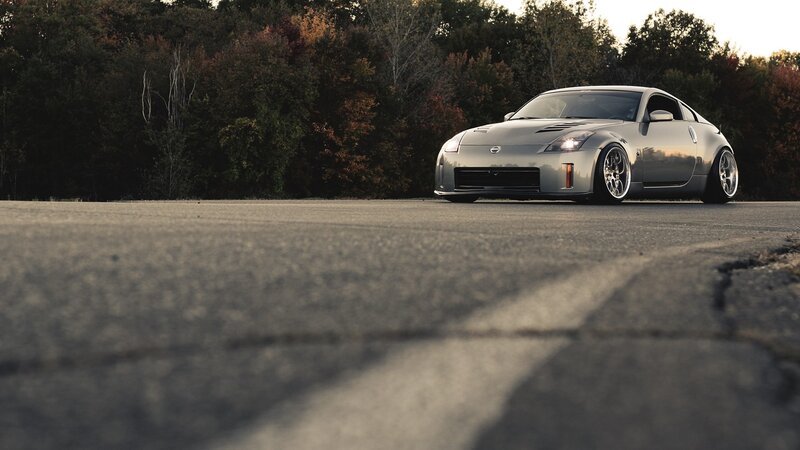 silver sports car on asphalt