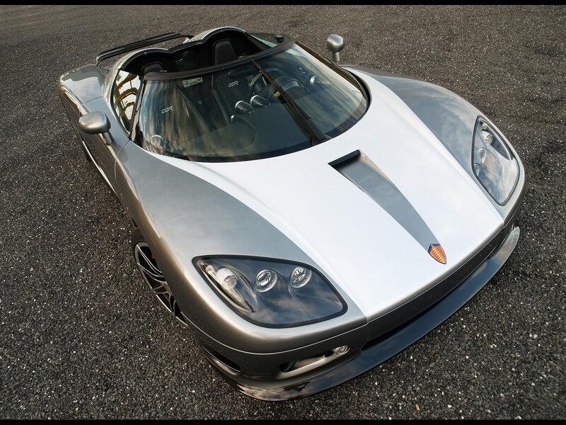 silver sports car on asphalt