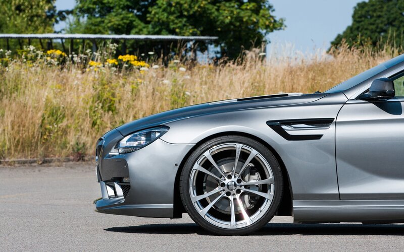 silver sports car on asphalt