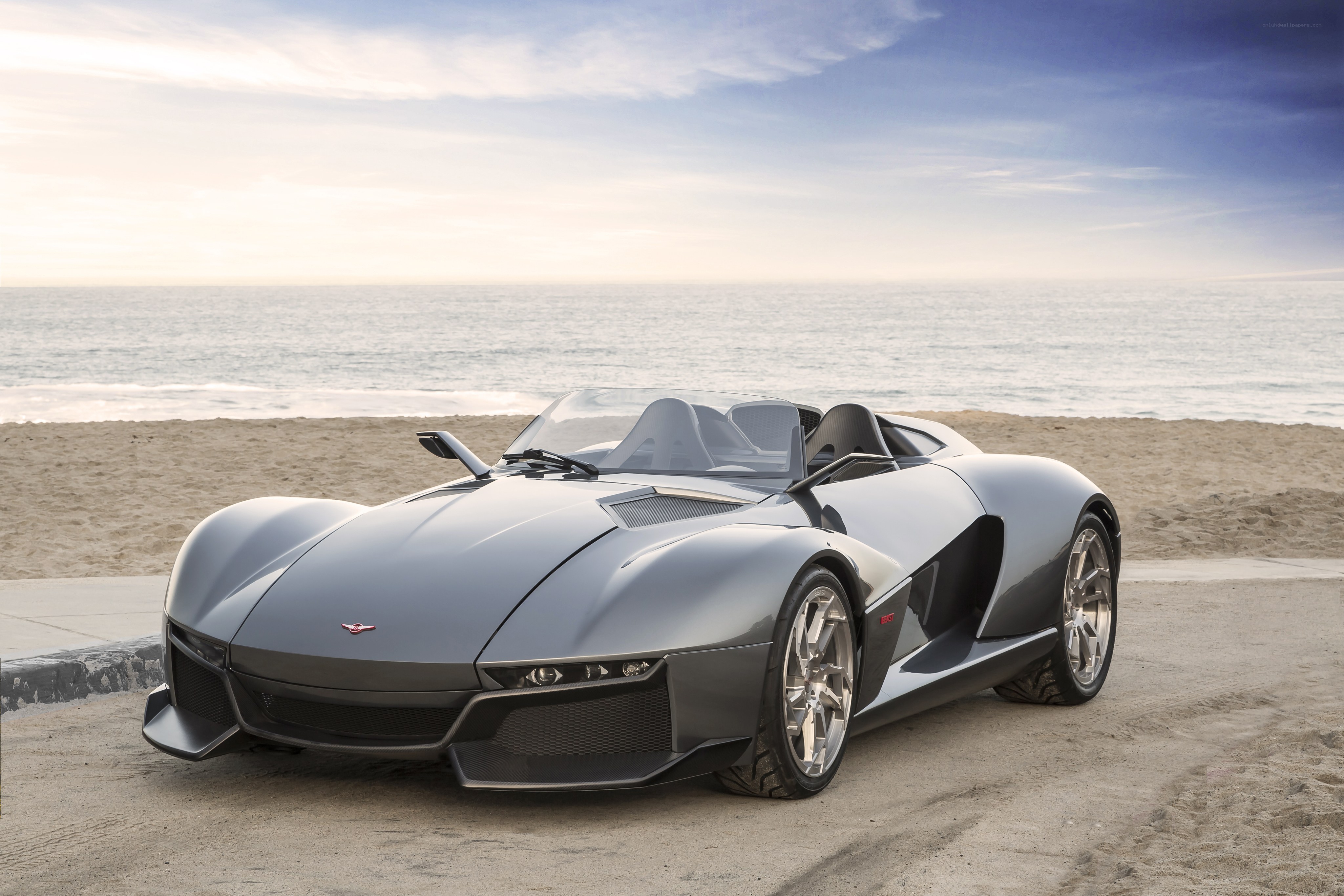 Silver sports car on beach