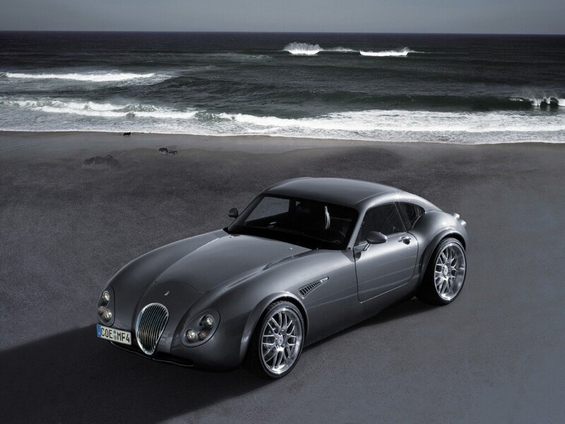 Silver sports car on beach