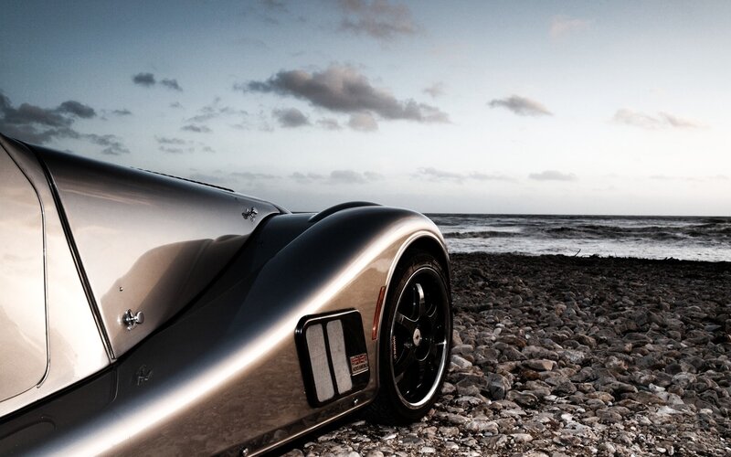 Silver Sports Car on Beach — Gray, Dramatic