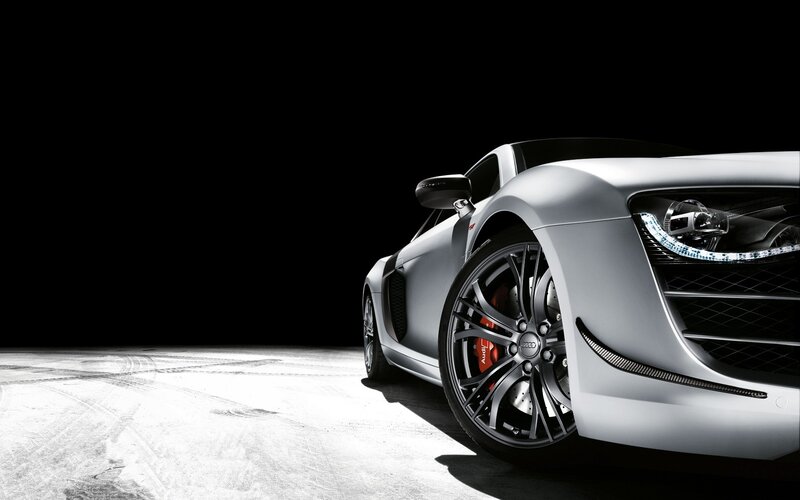 silver sports car on black background