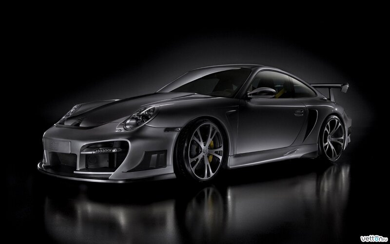 silver sports car on black background