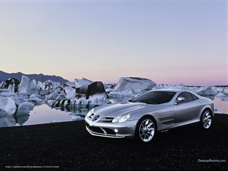Silver sports car on black sand