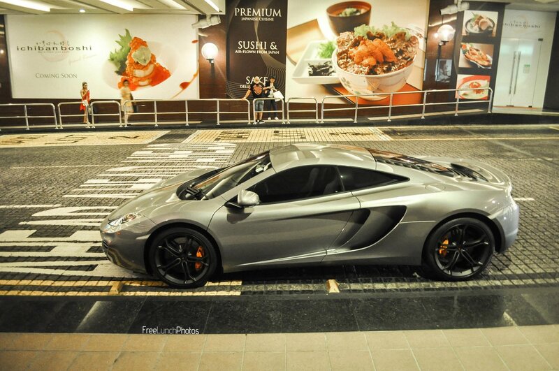 Silver sports car on city street