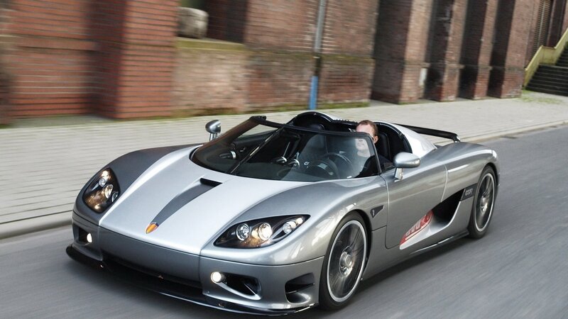 silver sports car on city street