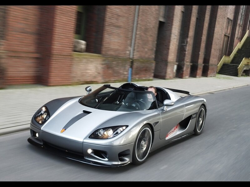 silver sports car on city street