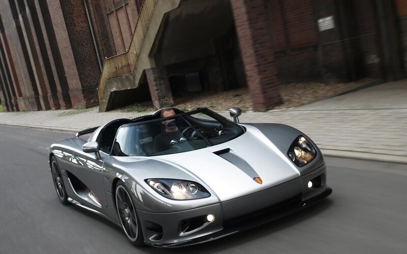 silver sports car on city street