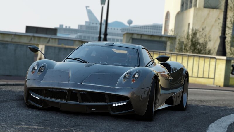silver sports car on city street