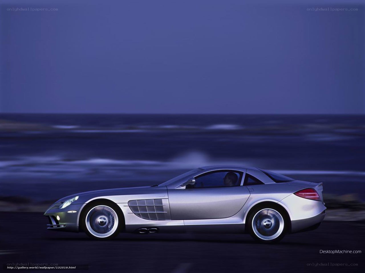 Silver sports car on coastal road