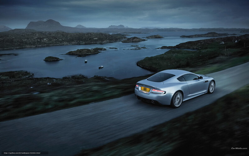 Silver sports car on coastal road