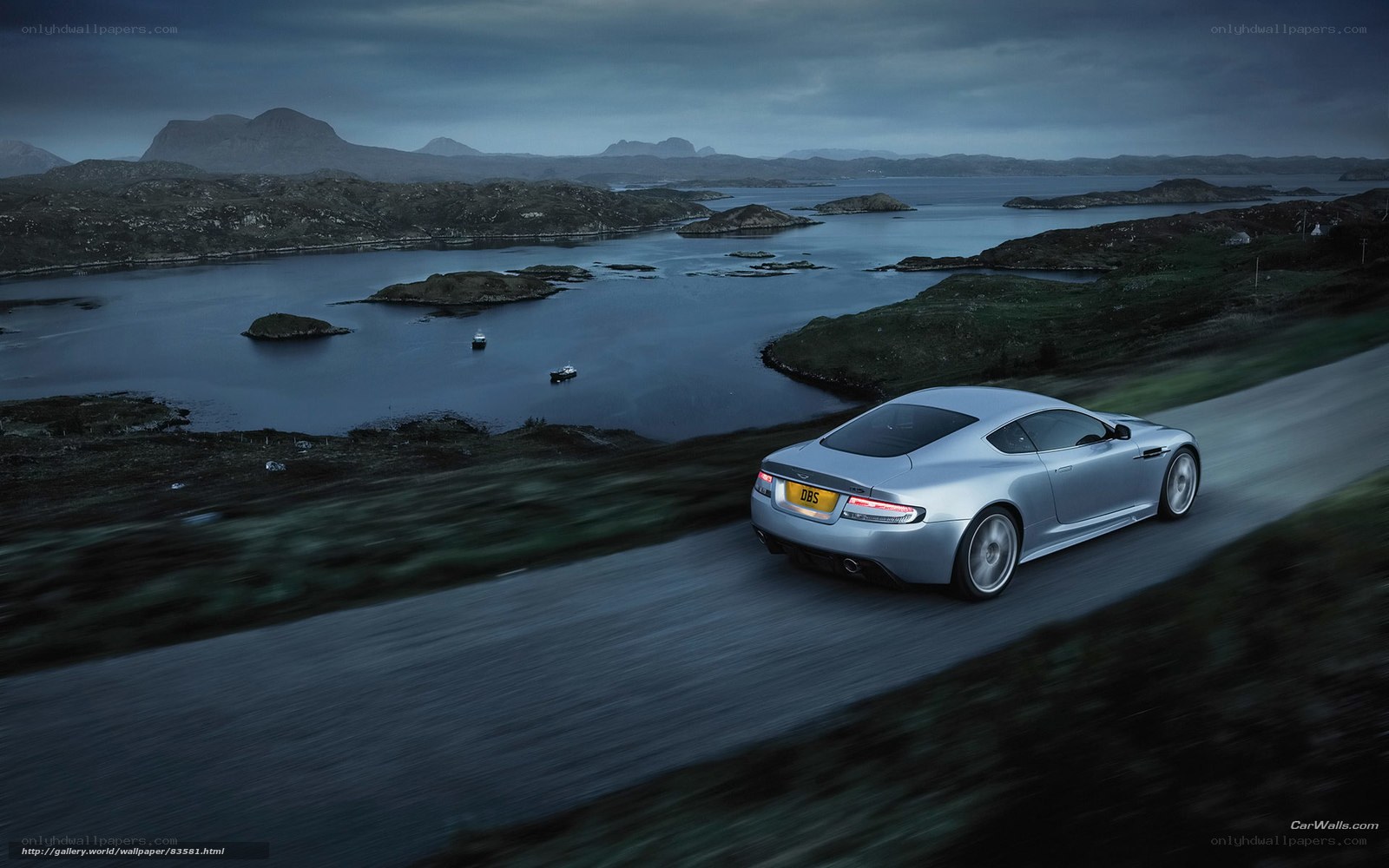 Silver sports car on coastal road