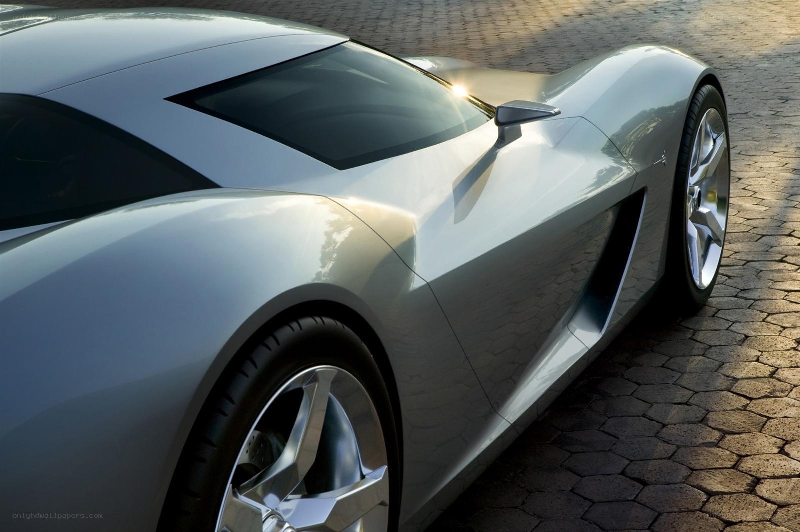 silver sports car on cobblestone