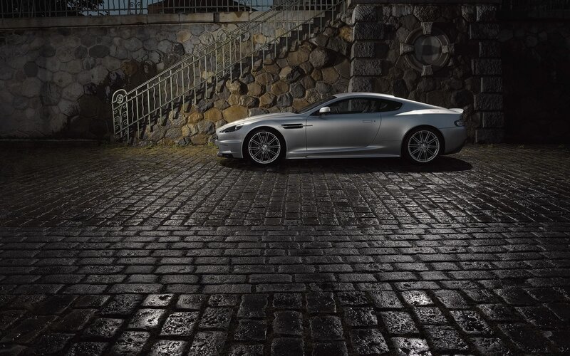 Silver sports car on cobblestones