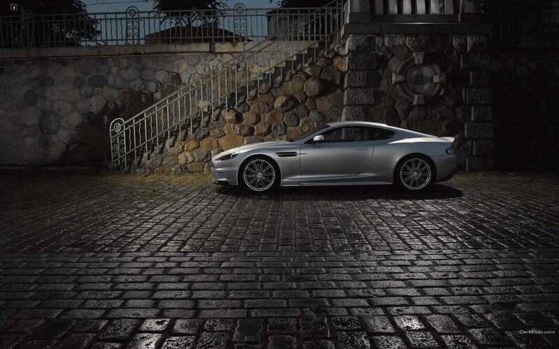 silver sports car on cobblestones