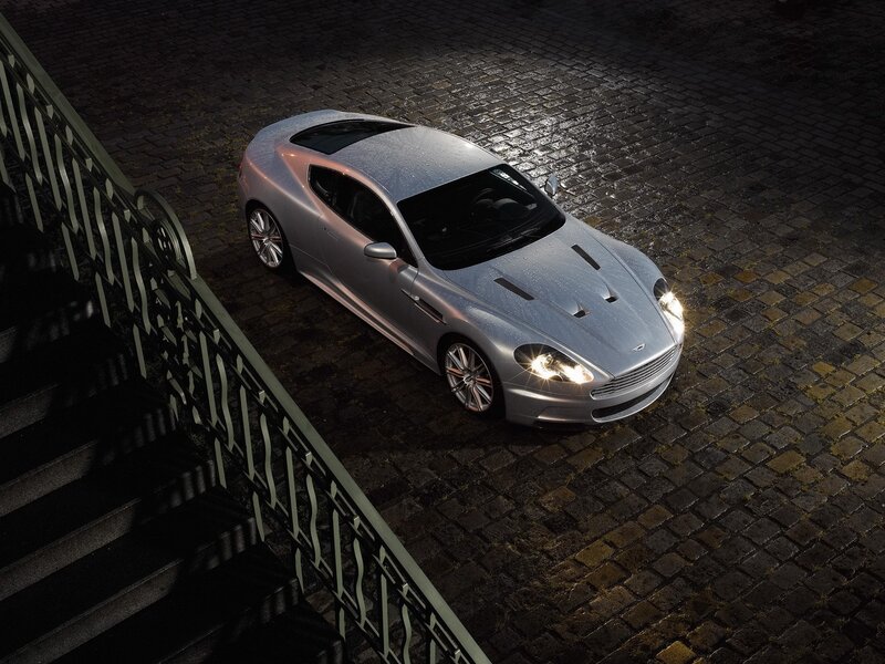 silver sports car on cobblestones