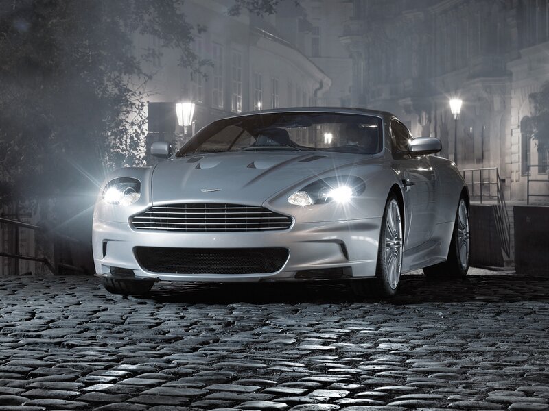 Silver sports car on cobblestones