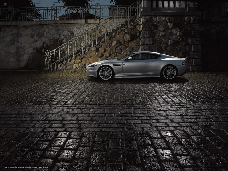 Silver sports car on cobblestones