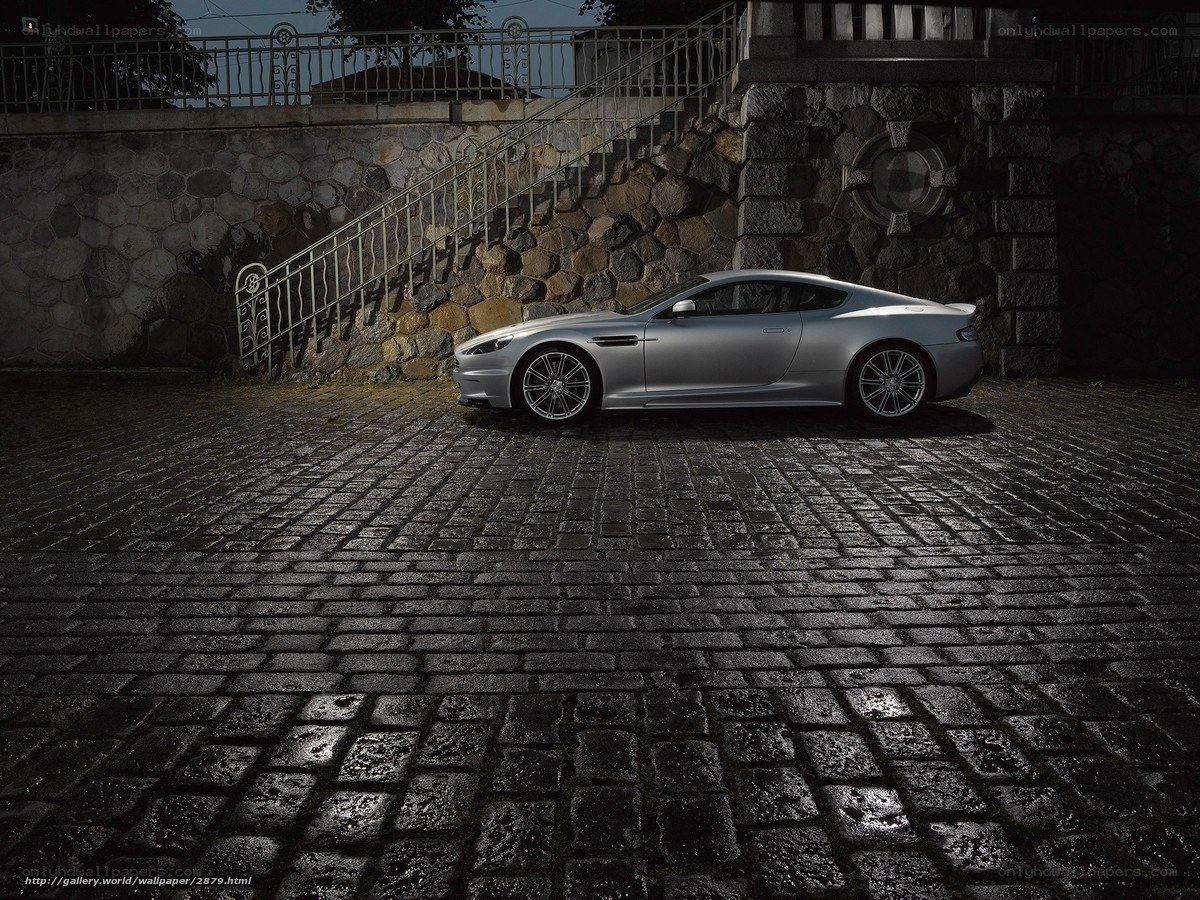 Silver sports car on cobblestones