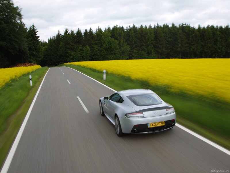 silver sports car on country road