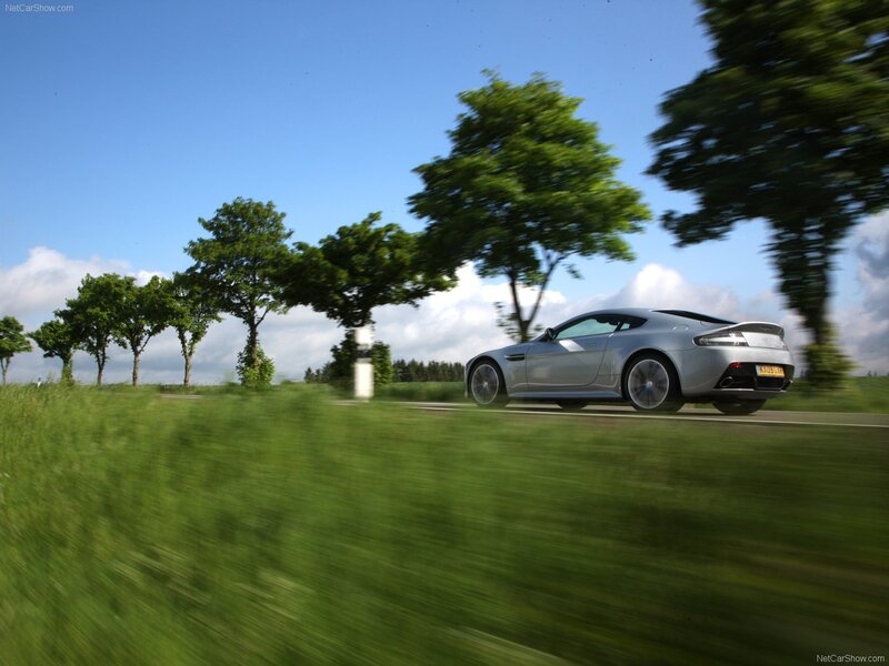 silver sports car on country road