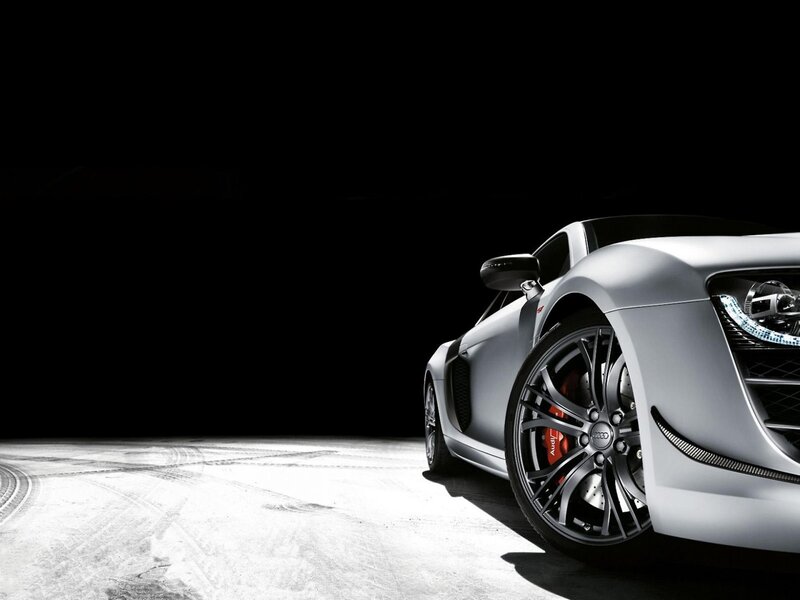 silver sports car on dark background