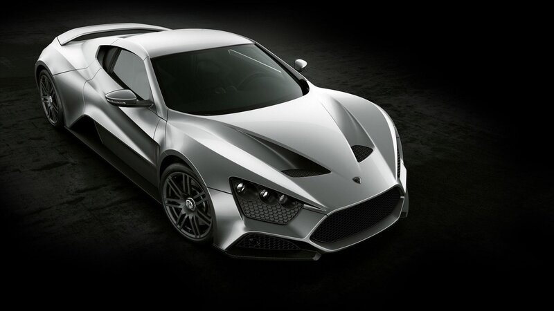 silver sports car on dark background