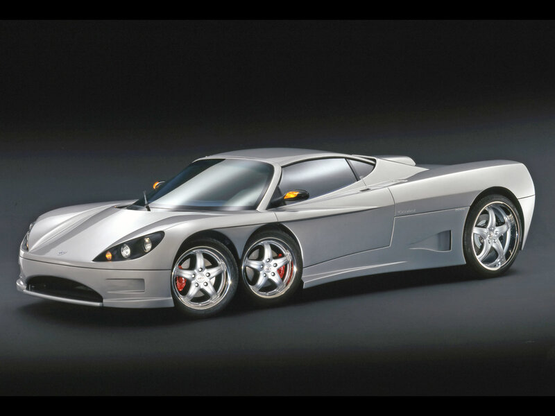 silver sports car on dark background