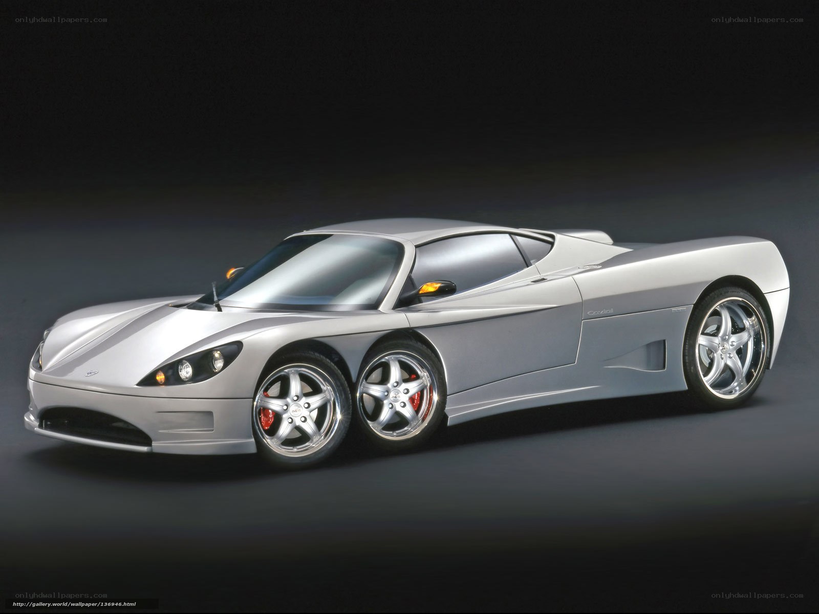 Silver sports car on dark background