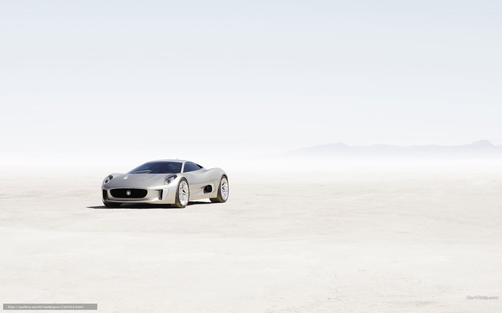 Silver sports car on desert plain