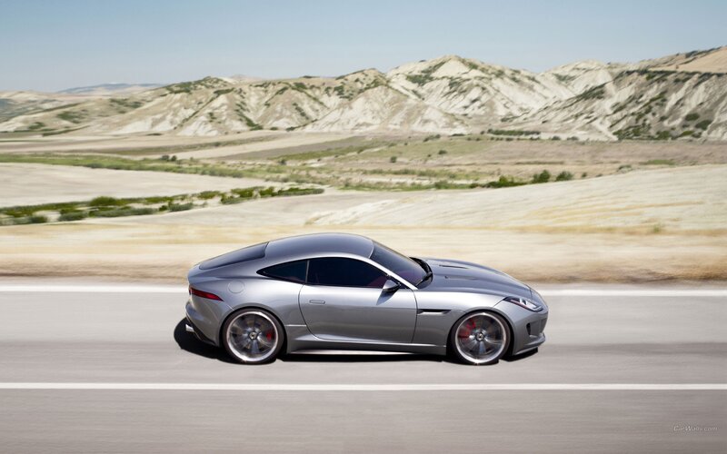 silver sports car on desert road