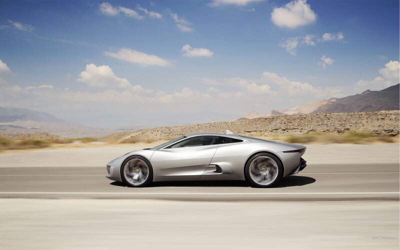 Silver sports car on desert road