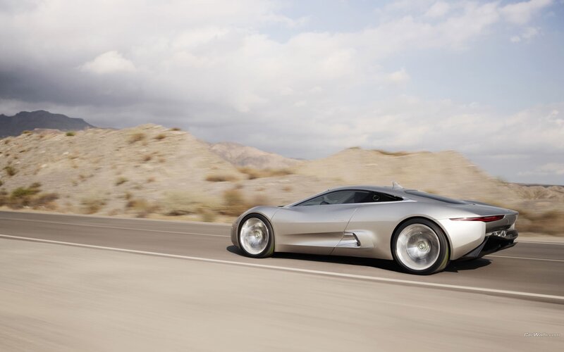 Silver sports car on desert road
