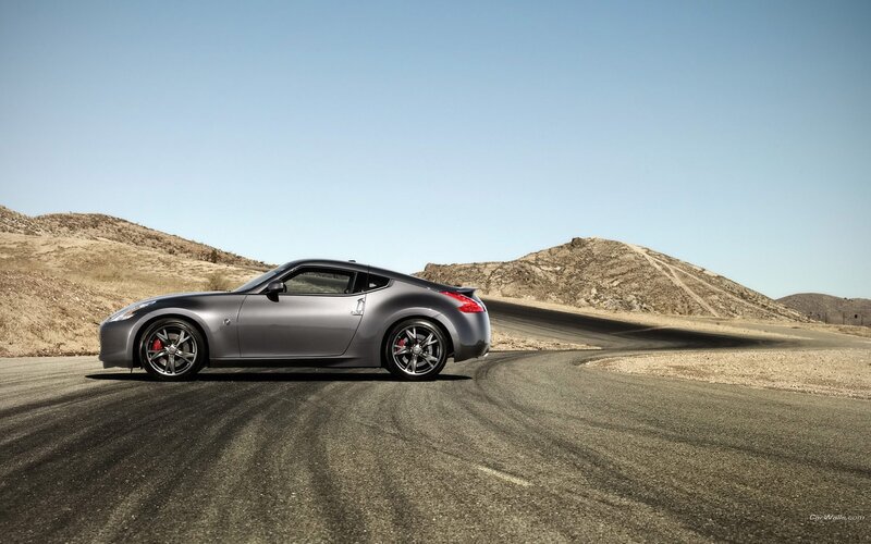 silver sports car on desert road