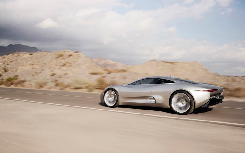 Silver sports car on desert road