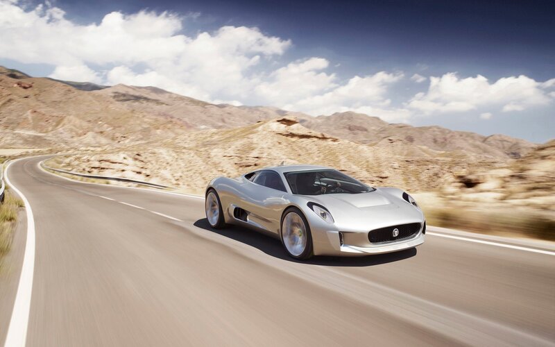 Silver sports car on desert road