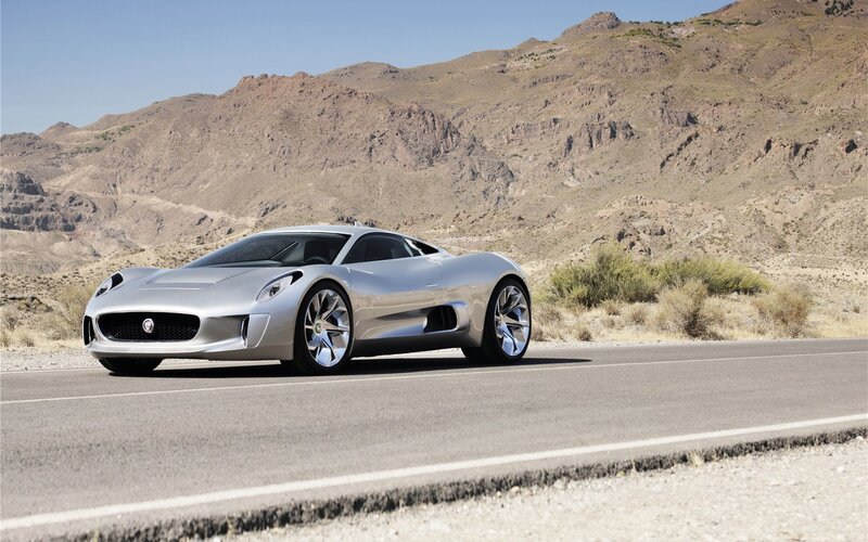 Silver sports car on desert road