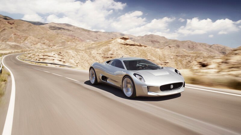 Silver sports car on desert road