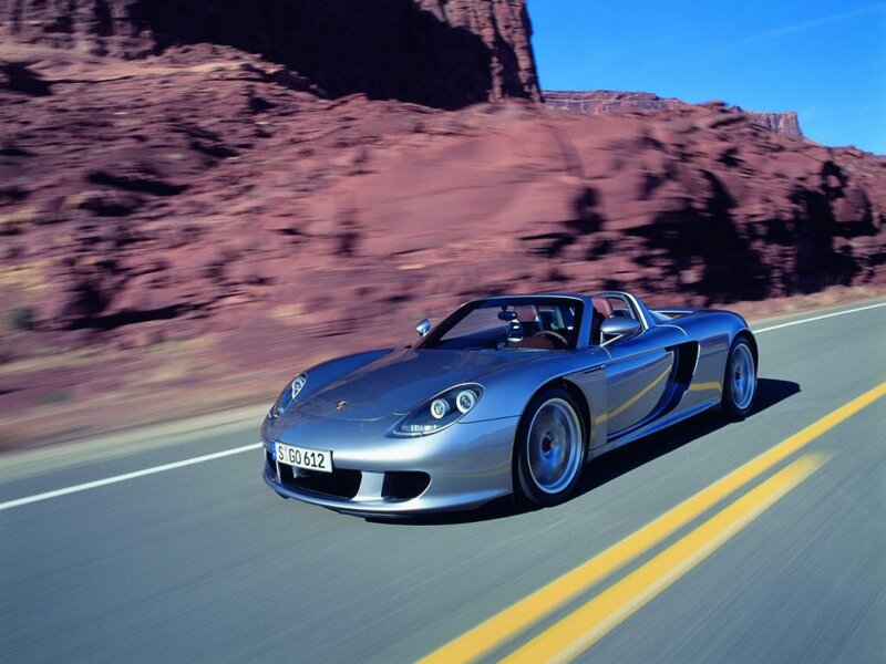 silver sports car on desert road