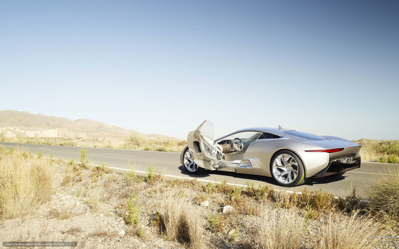 Silver sports car on desert road
