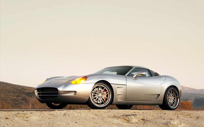 silver sports car on dirt road