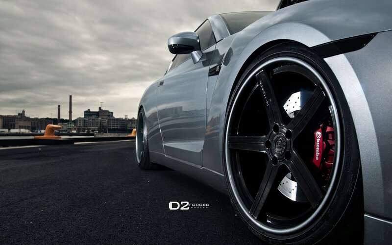 silver sports car on dock