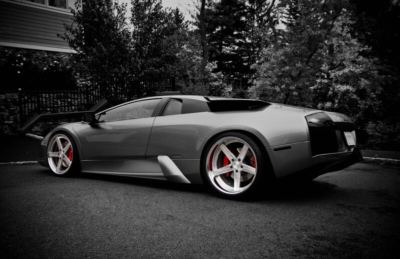 silver sports car on driveway