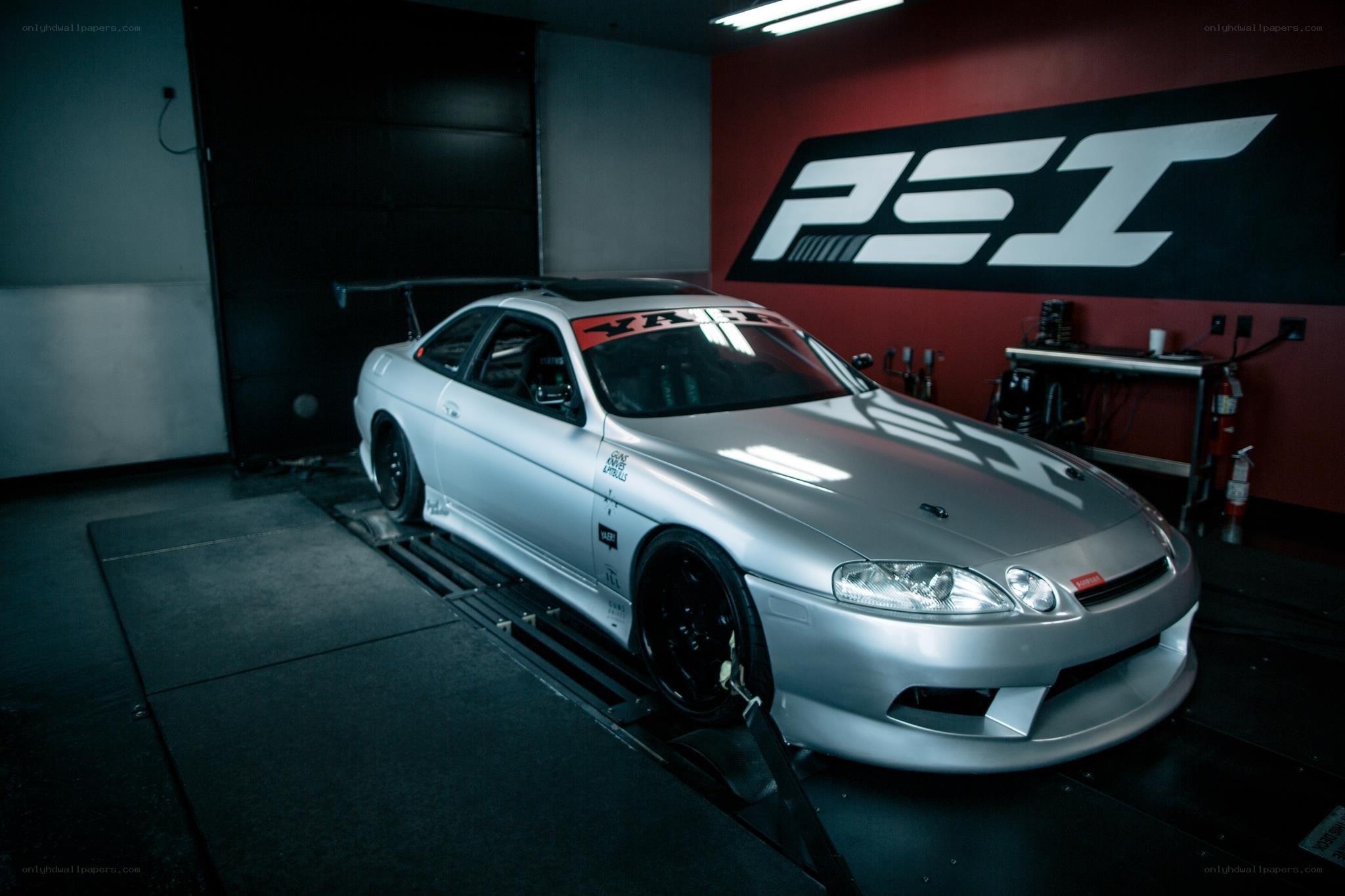 Silver sports car on dynamometer