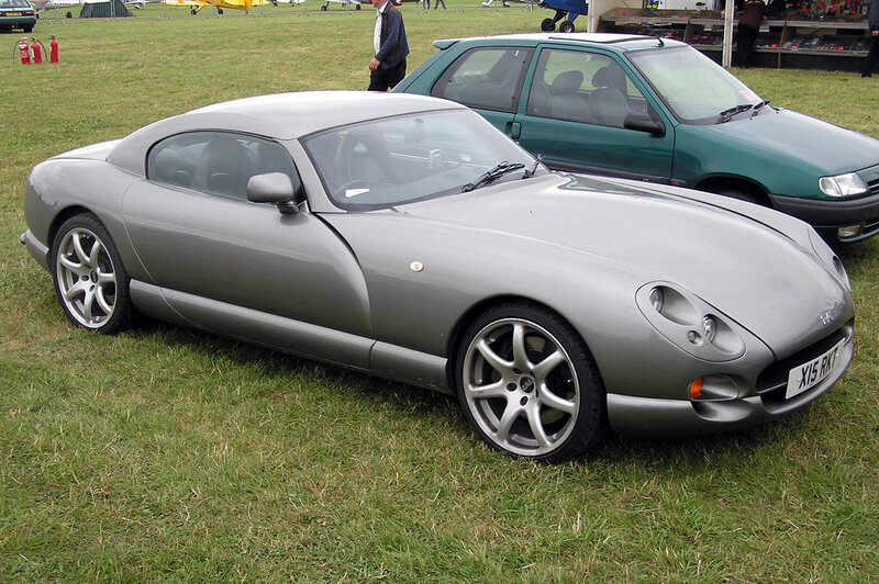 Silver sports car on grass